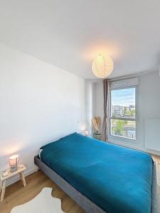 Ένα ή περισσότερα κρεβάτια σε δωμάτιο στο T3 avec loggia, Clim et parking - Proche Montpellier +34 φωτογραφίες