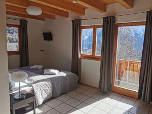 Postel nebo postele na pokoji v ubytování Katharinas Veganer Naturgasthof