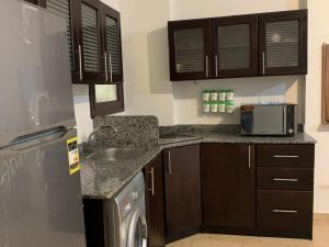 a kitchen with a sink and a dishwasher at One Bedroom Chalet with Side Sea View ,Turtles, Hurghada Concierge D 14 6 in Hurghada +4 photos