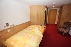 Ένα ή περισσότερα κρεβάτια σε δωμάτιο στο Hotel Gspan