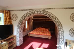 Ένα ή περισσότερα κρεβάτια σε δωμάτιο στο Hotel Gspan