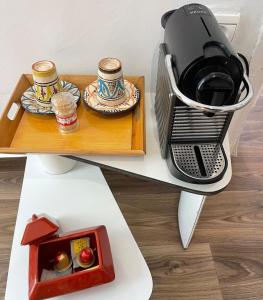 a coffee maker on top of a table at Best of Tangiers Heart in Tangier