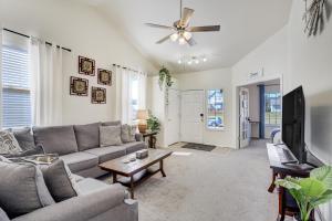 a living room with a couch and a flat screen tv at The Cozy Oak - Main Level Comforts in Fountain
