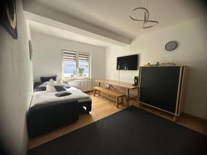 a bedroom with a bed and a desk in it at Haus Alpina in Garmisch-Partenkirchen