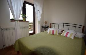 Postel nebo postele na pokoji v ubytování Ferienhaus Malupe by Villas Guide