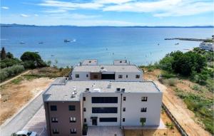 an aerial view of a building near the water at Beautiful Apartment In Privlaka in Glavan