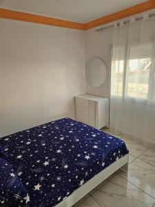 Postel nebo postele na pokoji v ubytování Dartoumana Ogla Zarzis EL Bahia + 1 fotografie