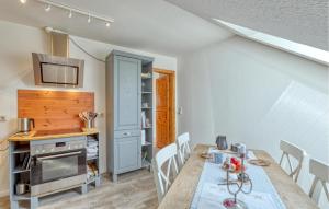 a kitchen and dining room with a table and chairs at Stunning Apartment In Klanxbüll With Wifi in Klanxbüll
