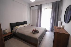 Ένα ή περισσότερα κρεβάτια σε δωμάτιο στο Katerina's apartment