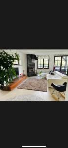 a living room with a couch and a table at Willa Solina in Solina