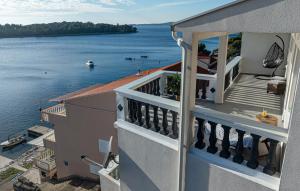 a balcony of a building with a view of the water at Apartment Karbuni Royal by Villas Guide in Brnistrova