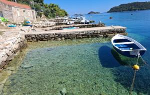 a boat is docked in a body of water at Apartment President by Villas Guide in Brnistrova