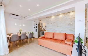 a living room with a couch and a dining room at Apartment President by Villas Guide in Brnistrova