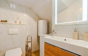 a bathroom with a sink and a mirror at Apartment President by Villas Guide in Brnistrova +17 photos