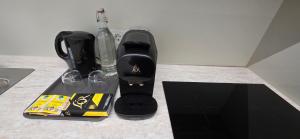 a black blender sitting on a counter top at Aupark Apartments in Vienna