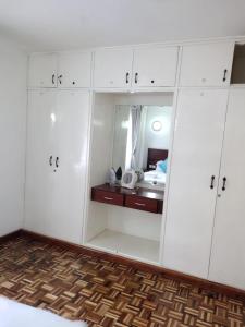 Ένα ή περισσότερα κρεβάτια σε δωμάτιο στο G Suites Westlands +6 φωτογραφίες