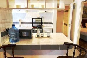 Η κουζίνα ή μικρή κουζίνα στο G Suites Westlands