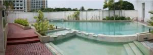 a large swimming pool on top of a building at WestParc Cedar Alabang in Manila