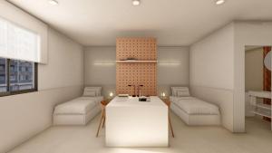 a living room with two beds and a table at CAN MATT Coliving and Residence in Tarragona