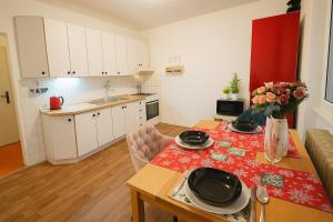 a kitchen and dining room with a table and a kitchen at Star #2B215 in Brno