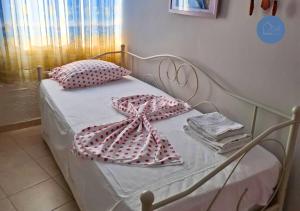 Postel nebo postele na pokoji v ubytování EA Apartments + 19 fotografií