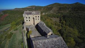 an old castle on top of a mountain at Appartement Authentique Montaigut in Montégut