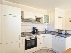 Køkken eller tekøkken på Brise Ferienhaus Viola + 11 billeder