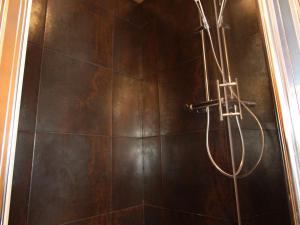 a shower with a hose in a bathroom at Appartement ski aux pieds, centre Val d'Isère, jusqu'à 6 pers, WIFI - FR-1-519-31 in Val dʼIsère +10 photos