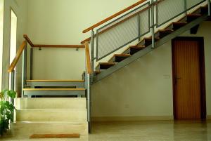 a staircase in a building with a stair case at Residencial Valinho in Mendiga