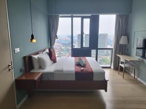 Ένα ή περισσότερα κρεβάτια σε δωμάτιο στο Casaluma STAR KLCC +100 φωτογραφίες