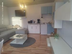 a living room with a couch and a table at Möb Monteurapartment in Gladbeck in Gladbeck