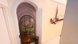a hallway with a glass door in a wall at Do Campanili by Ca-Sa Check in Chioggia