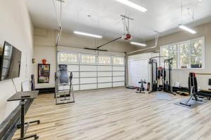 a gym with treadmills and machines in a room at All-Season Outdoor Base Camp Gold Country Home! in Fiddletown