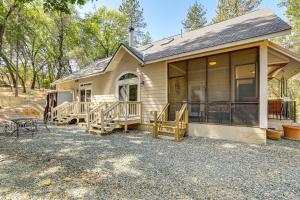 a small house with a porch and a patio at All-Season Outdoor Base Camp Gold Country Home! in Fiddletown