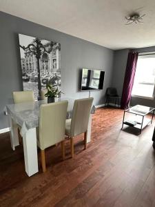 a dining room with a table and chairs at Two bedroom flat close to meadows with free parking by parking permit in Edinburgh