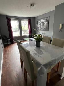a dining room with a table and chairs at Two bedroom flat close to meadows with free parking by parking permit in Edinburgh