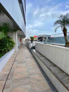 a balcony of a building with a view of the ocean at Studio Unique 2802 com garagem á 15 min do centro de Belém in Belém