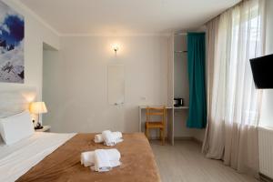 Ένα ή περισσότερα κρεβάτια σε δωμάτιο στο Tato