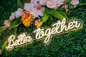 a sign that says better together on a bouquet of flowers at Lookout Luxe 2BR | King + Q/Q Bunk | Shuffleboard in Audelia +17 photos