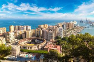 a view of a city with the ocean and buildings at Villa Mayxar in Almáchar