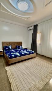 Una cama o camas en una habitación de Afam Group