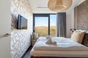 Ένα ή περισσότερα κρεβάτια σε δωμάτιο στο Residence Westduin