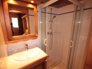 a bathroom with a sink and a shower with a mirror at Les Saisies: 3 pièces cosy, 2 sdb, balcon, parking, 6 pers - FR-1-293-78 in Villard-sur-Doron +11 photos