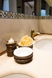 a bathroom counter with a sink and a plate of food at Villa La Giulia in Cerveteri +66 photos
