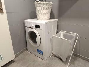 a washing machine with a basket on top of it at Room 1 industrial in Krakow