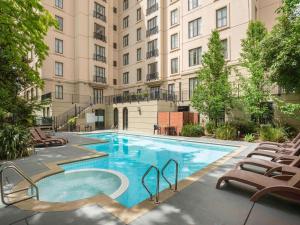 a large swimming pool in front of a building at Mantra on Jolimont Melbourne in Melbourne