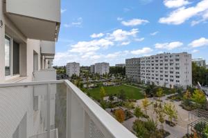 a balcony with a view of a city at Bratislava Airport Apartment in M R Stefanik