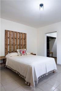 Ένα ή περισσότερα κρεβάτια σε δωμάτιο στο Hotel Cassaterra