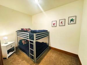 a bedroom with two bunk beds in a room at 3BR King Bed Chamber Apartment at The Grand Castle in Grandville