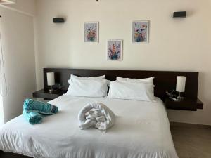 Ένα ή περισσότερα κρεβάτια σε δωμάτιο στο La Poza Condominio +14 φωτογραφίες